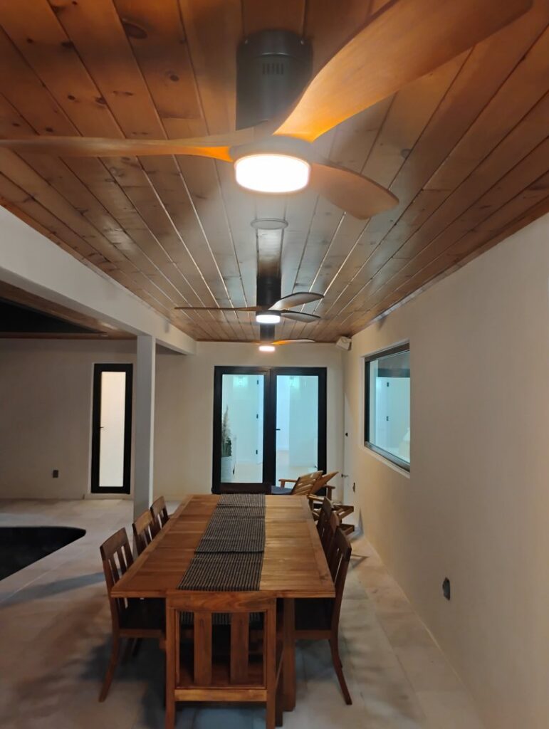 Multiple ceiling fans with integrated lighting installed in a room, demonstrating electrical services by Envision Electrical Solutions in Fort Lauderdale, FL.