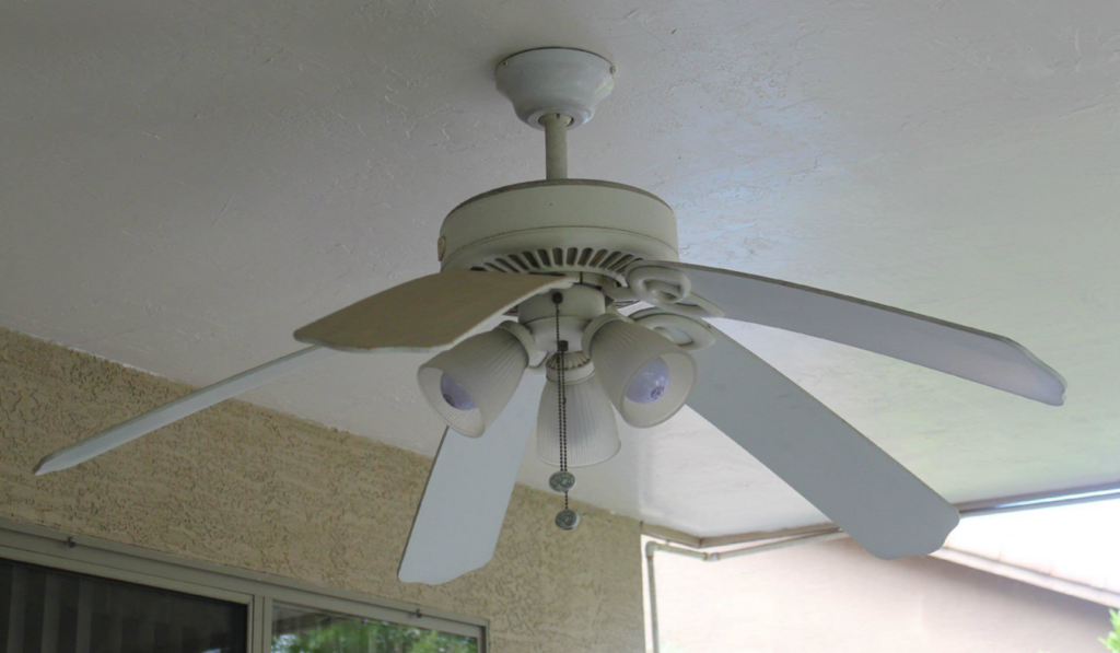 A white ceiling fan with lights installed on a patio ceiling by Albritton Electrical Service, Inc. in Tallahassee, FL.