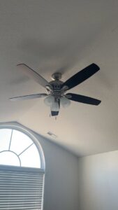 A ceiling fan with lights installed on a vaulted ceiling by Geter Electrical Services LLC in Fountain Inn, SC.