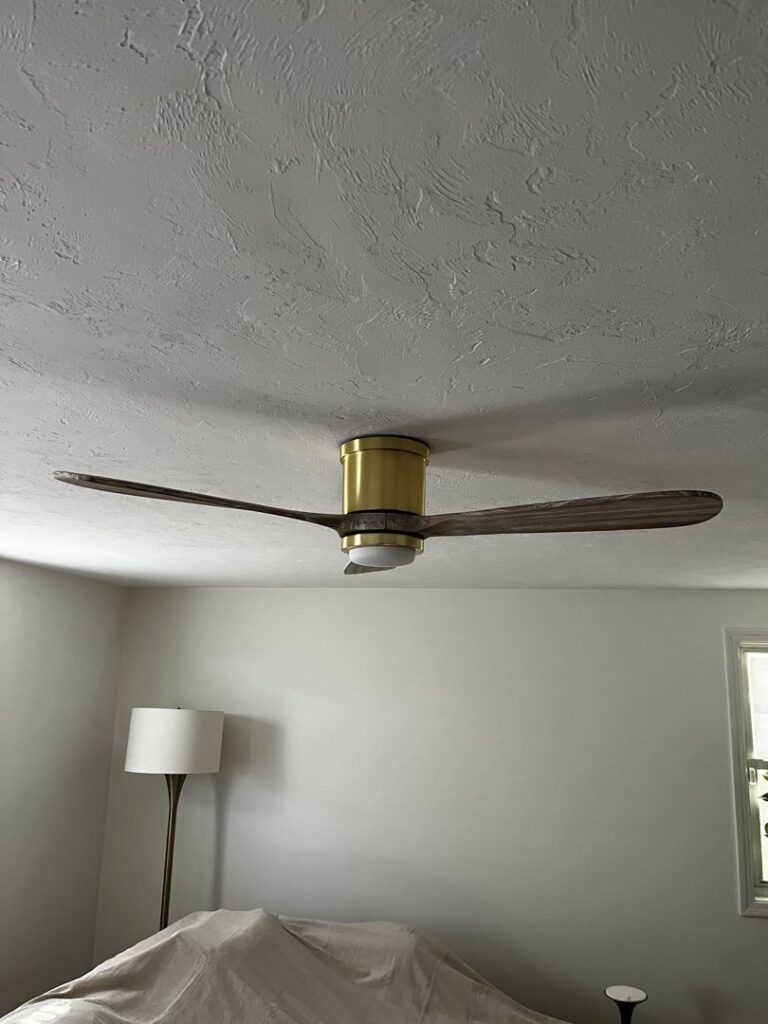 A stylish ceiling fan with an integrated light fixture installed by Richard Sullivan Licensed Electrician in Brockton, MA.