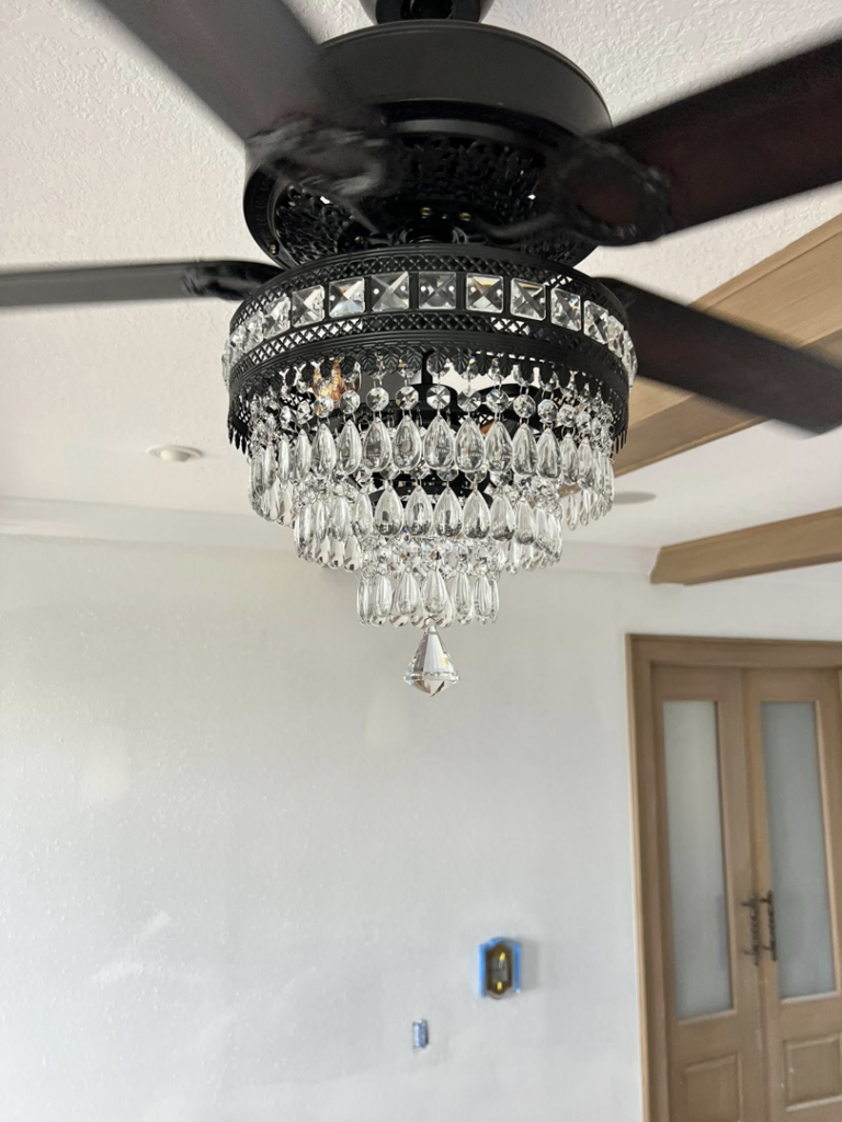 Close-up of a new ceiling fan with a crystal light fixture installed by ABD Electric USA in Tampa, FL.