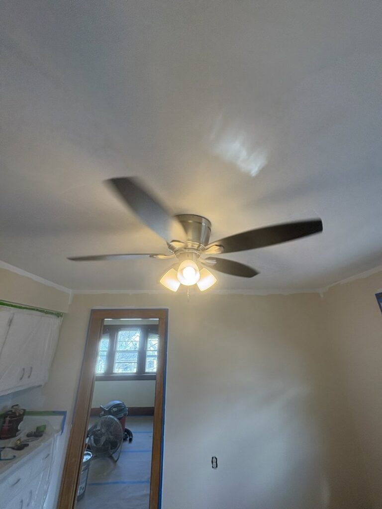 A newly installed ceiling fan with lights by Advance Electrical Contractors in Milwaukee, WI.
