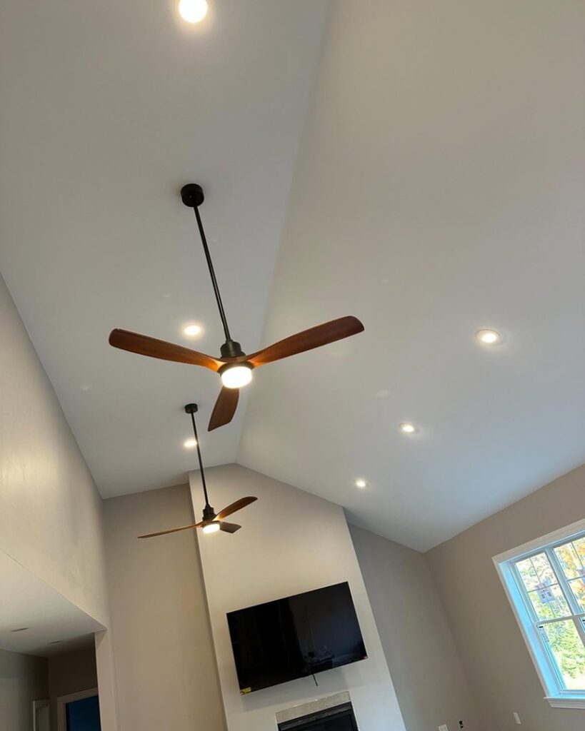New ceiling fans and recessed lighting installed in a living room by Breakers Electric LLC in Dover, NH.