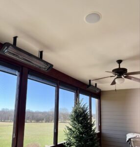 Ceiling-mounted electric heaters and a fan installed in a patio by Pinnacle Electric Solutions in Port St. Lucie, FL.