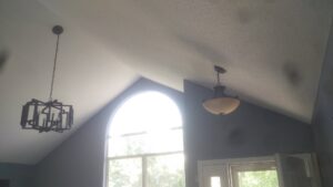 Two decorative ceiling light fixtures installed in a room, showcasing lighting installation by GOBE LLC in Columbia, MO.