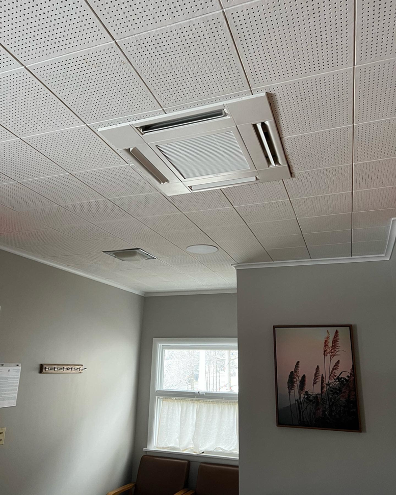 Ceiling-mounted HVAC cassette unit installed by CC Mechanical in Portland, ME.