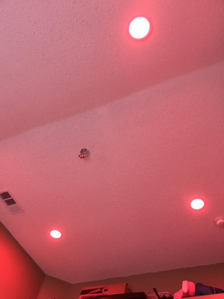 Ceiling with red recessed lighting installed by AVA Electric, LLC in Fort Worth, TX.