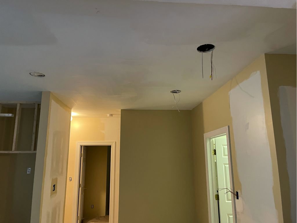 Ceiling wiring for recessed lights during a home renovation project by Denny Power Solutions in Virginia Beach, VA