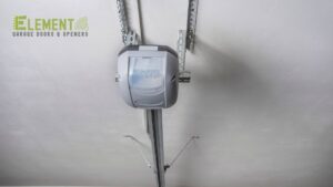 A chain-drive garage door opener system installed overhead, showcasing reliable operation by Element Garage Door Repair Of Portland, OR