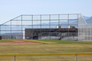 A newly installed chain-link fence surrounding a baseball field by Life Time Fence, Inc. in Cedar Rapids, IA.