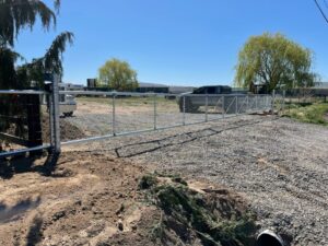 A chain-link fence with a gate installed by Integrity Gates and Fencing in Yakima, WA