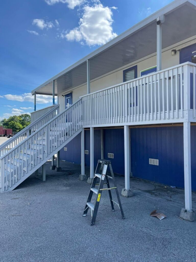 A backyard with a children's playset and a durable chain-link fence installed by Preston's Fencing and Decks LLC in Murfreesboro, TN.