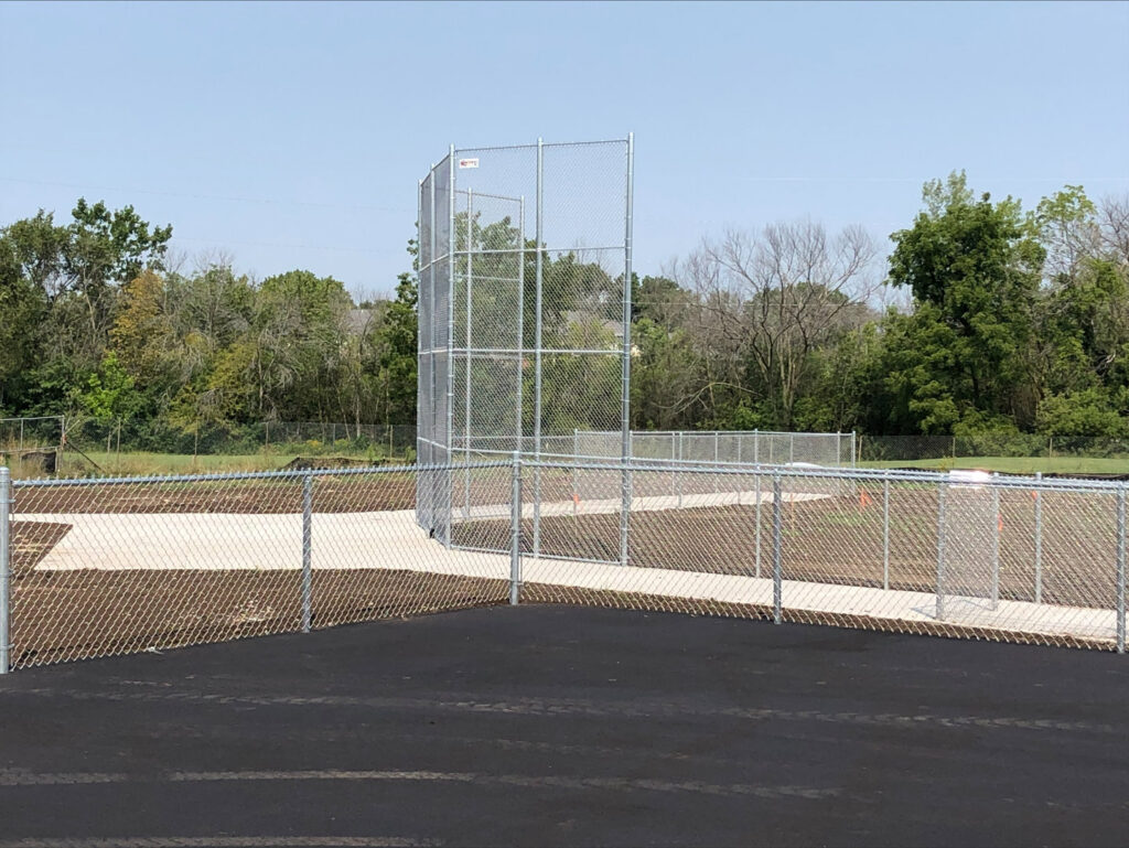 Chain-link fence and backstop installed at a baseball field by Northway Fence in Menomonee Falls, WI.