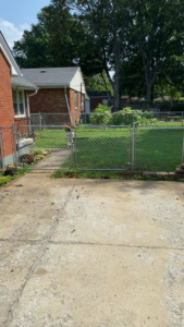 A completed chain link fence and gate installation by Higdon's fence install & repair in White Mills Junction, KY