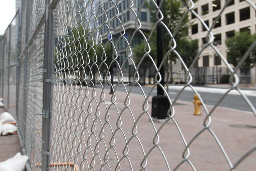 Close-up view of a newly installed chain-link fence by Checkmate Global in Frederick, MD.