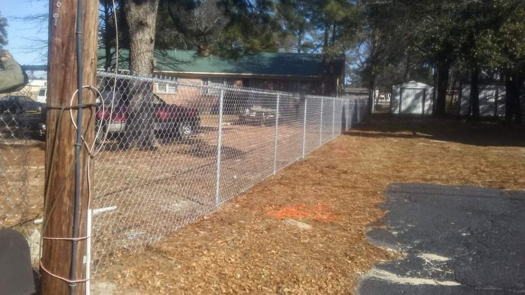 A long chain-link fence installed by Rowe Fence & Supply in New Kent, VA.