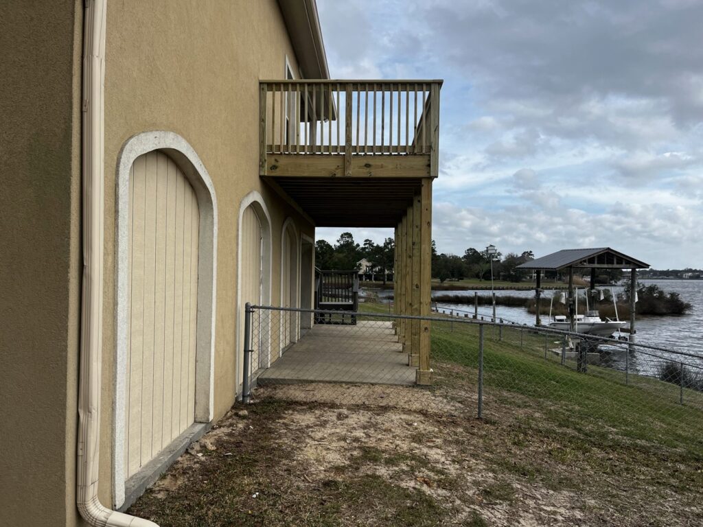 A chain link fence installed along a waterfront property by Deep South Services LLC in Biloxi, MS.