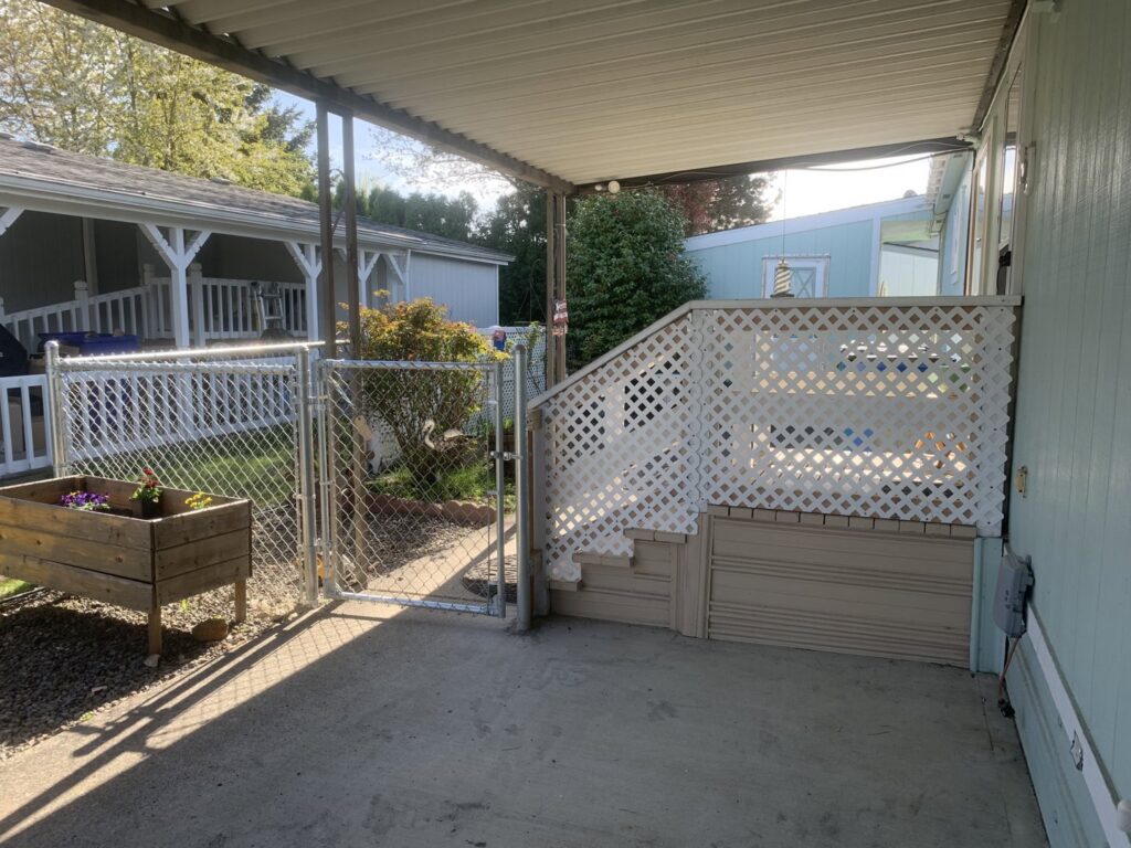 A durable chain link fence with a gate, installed for a residential property by Fence Repair Master in Vancouver, WA.