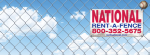 A chain-link fence with a "Rent-A-Fence" sign and a baseball, installed by National Construction Rentals in Las Vegas, NV.