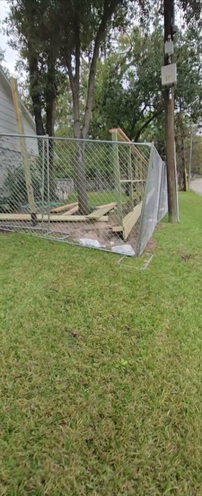 A chain link fence with wood framing being installed, showcasing versatile fencing options from Fence Builders of Houston, TX.