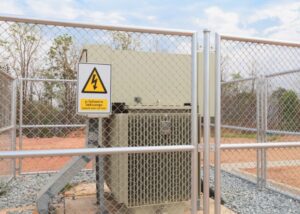 A chain link security fence around an electrical area, installed by Fence Company of Rhode Island in Providence, RI.
