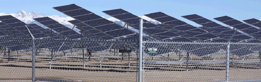 A chain-link fence securing a large solar panel farm, installed by Life Time Fence, Inc. in Cedar Rapids, IA.