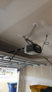 A Chamberlain garage door opener installed in a garage by 405 Garage Pros in Edmond, OK.