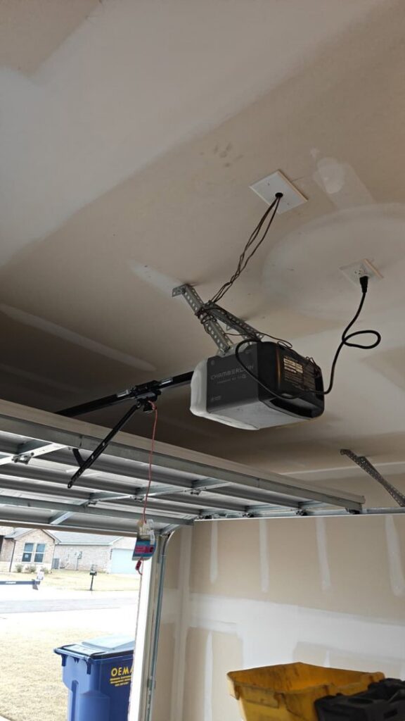 A Chamberlain garage door opener installed in a garage by 405 Garage Pros in Edmond, OK.