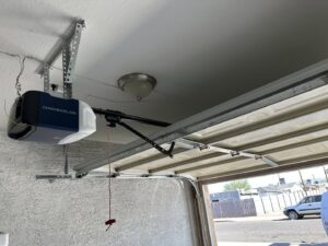 A newly installed Chamberlain garage door opener in a residential garage by Morning Star Garage Doors in Phoenix, AZ.