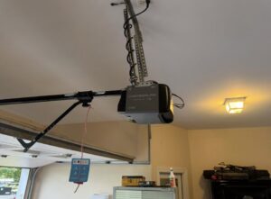 A Chamberlain garage door opener installed on a residential garage door by Swift Garage Door in Nashville, TN.