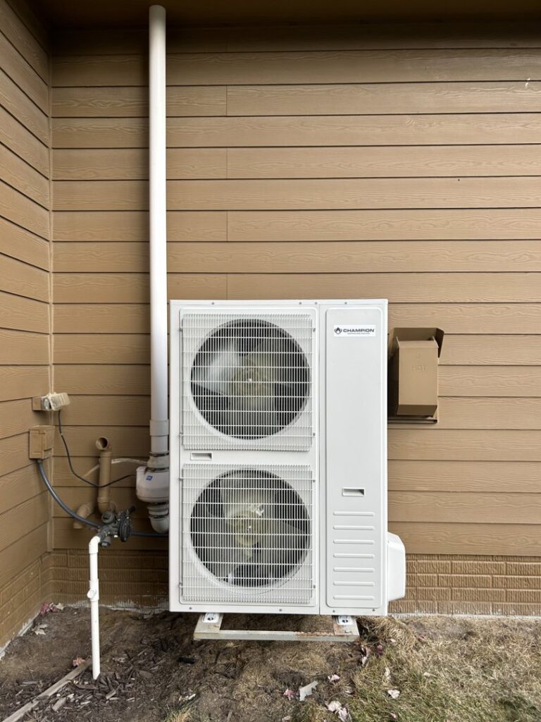 A new Champion dual-fan outdoor HVAC unit installed by Omega Air Solutions in West Des Moines, IA.