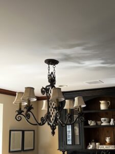 A decorative chandelier hanging from a ceiling, representing lighting installation services by D. Geer Electric Inc. in Waukegan, IL.