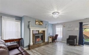 Elegant living room with a newly installed chandelier by Lindsey and Son Electric, LLC in Summerville, SC