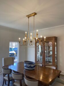 A beautiful chandelier expertly installed over a dining table by McCurley Electric in Little Rock, AR.