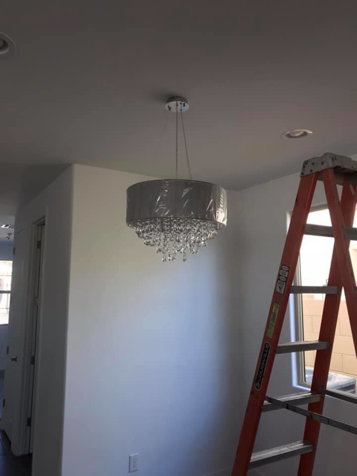 A newly installed decorative chandelier in a room, indicating electrical work by R&M Electric LLC in Gilbert, AZ.