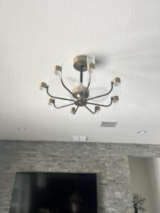 A stylish modern chandelier expertly installed on a ceiling by TAP and Sons Electric in Tempe, AZ.