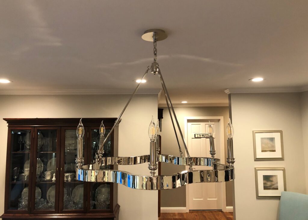 A modern chandelier installed in a dining room by Top Tier Electrical Services LLC in Knoxville, TN