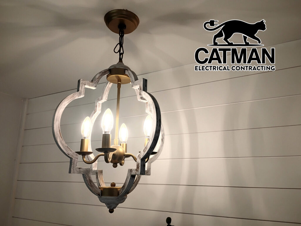 A decorative chandelier light fixture hanging from a ceiling, installed by Catman Electrical Contracting in Dallas, PA.