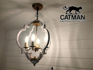 A decorative chandelier light fixture hanging from a ceiling, installed by Catman Electrical Contracting in Dallas, PA.