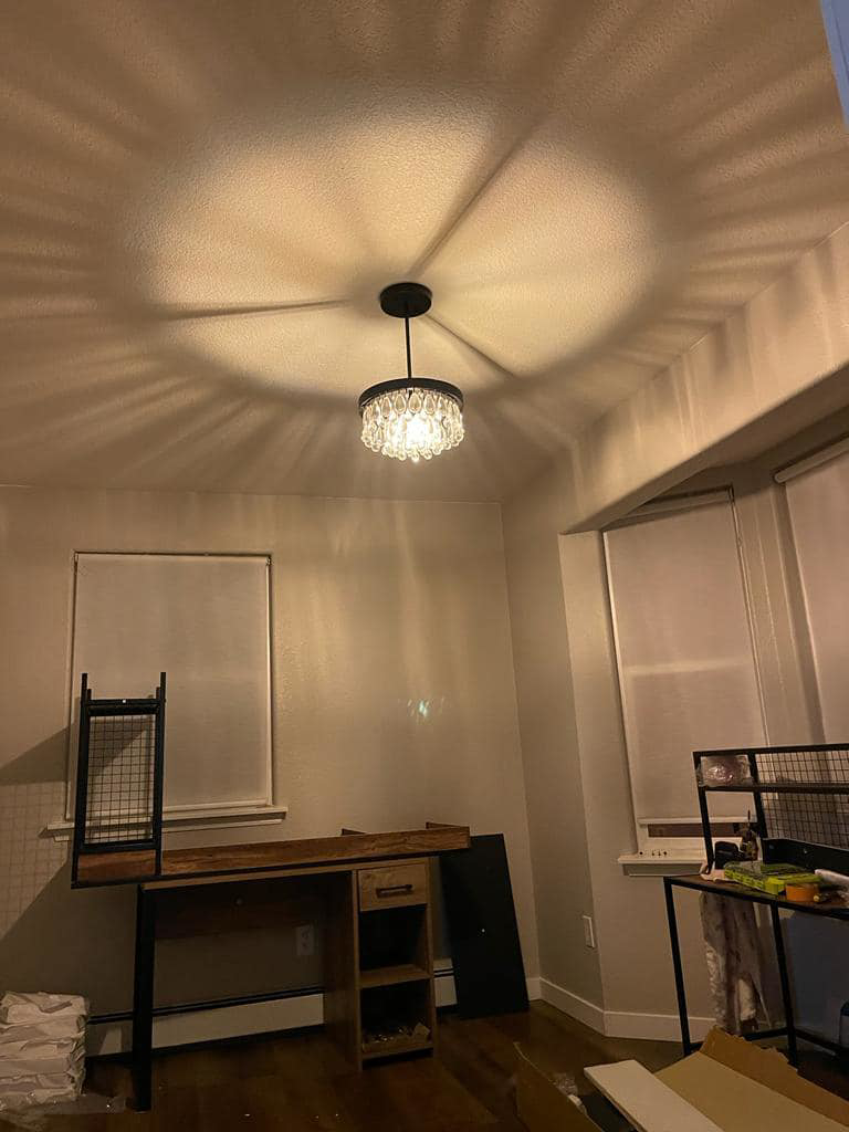 A decorative chandelier lighting fixture installed in a room by Jimenez Electric Inc in Denver, CO.