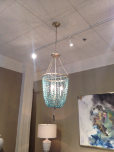 A decorative chandelier and track lighting installed on a ceiling by RightWay Electric RI in Providence, RI.