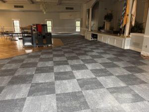 Checkerboard carpet tile design in a commercial event space by Branch Floor Covering in Cranston, RI