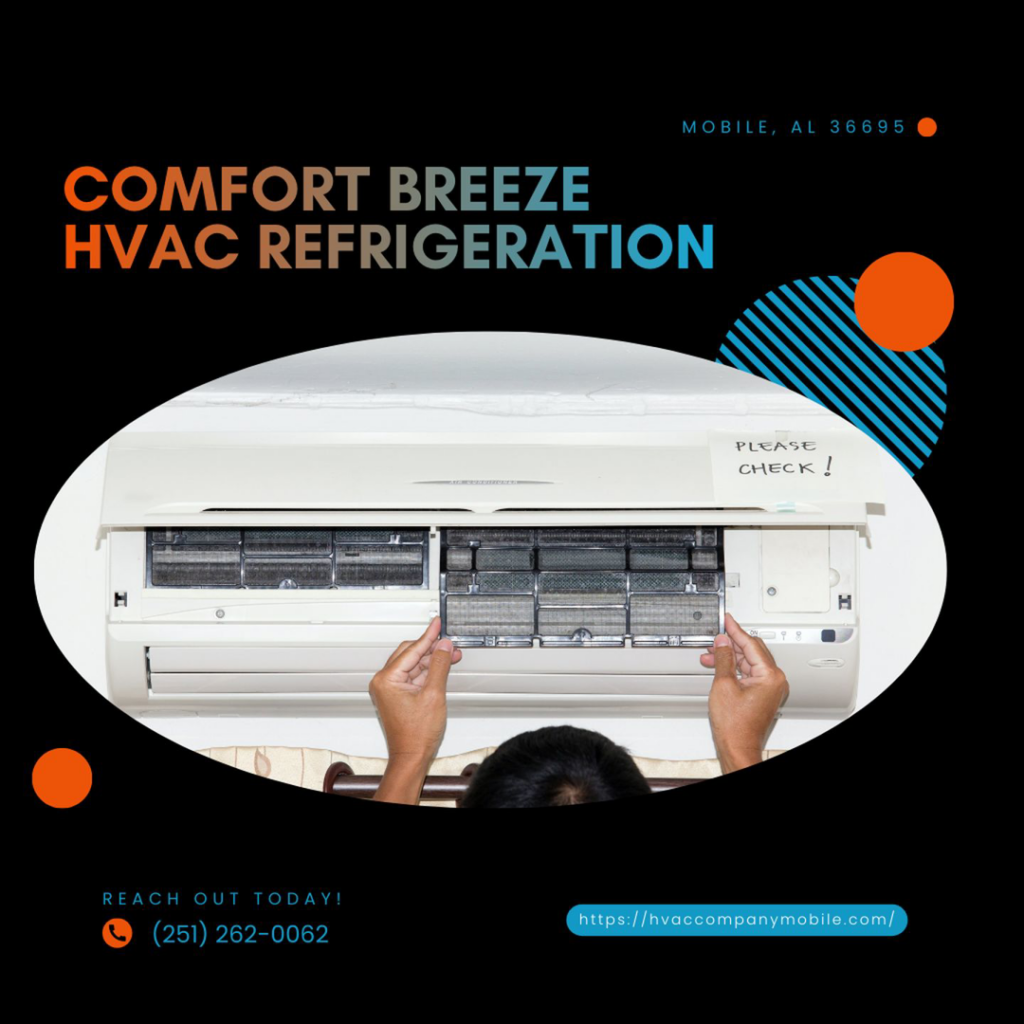 Hands checking the filters of an indoor mini-split AC unit by Comfort Breeze HVAC Refrigeration in Mobile, AL.