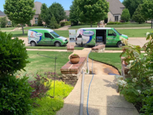 Two Precision Chem-Dry Of DFW service vans parked in a residential driveway, ready for a carpet cleaning job in North Richland Hills, TX.
