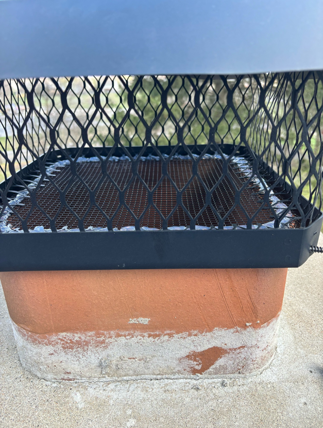 Chimney cap with mesh installed for wildlife exclusion by Animal Management Systems Inc in Noblesville, IN.