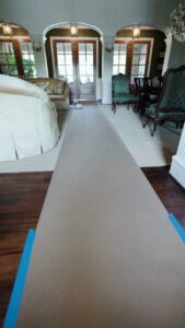 A chimney under construction or repair, showing wooden supports and a metal flue, by Brushers Chimneys in Houston, TX.