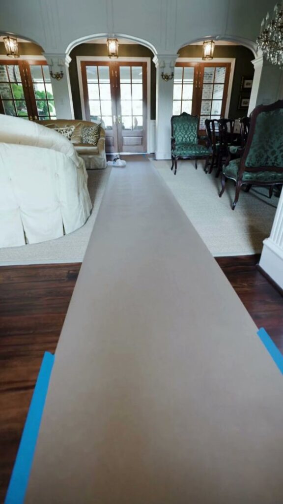 A chimney under construction or repair, showing wooden supports and a metal flue, by Brushers Chimneys in Houston, TX.