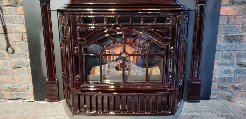 A technician from The Chimney Chap & South Shore Fireplace inspecting a chimney flue on a roof in Boston, MA.