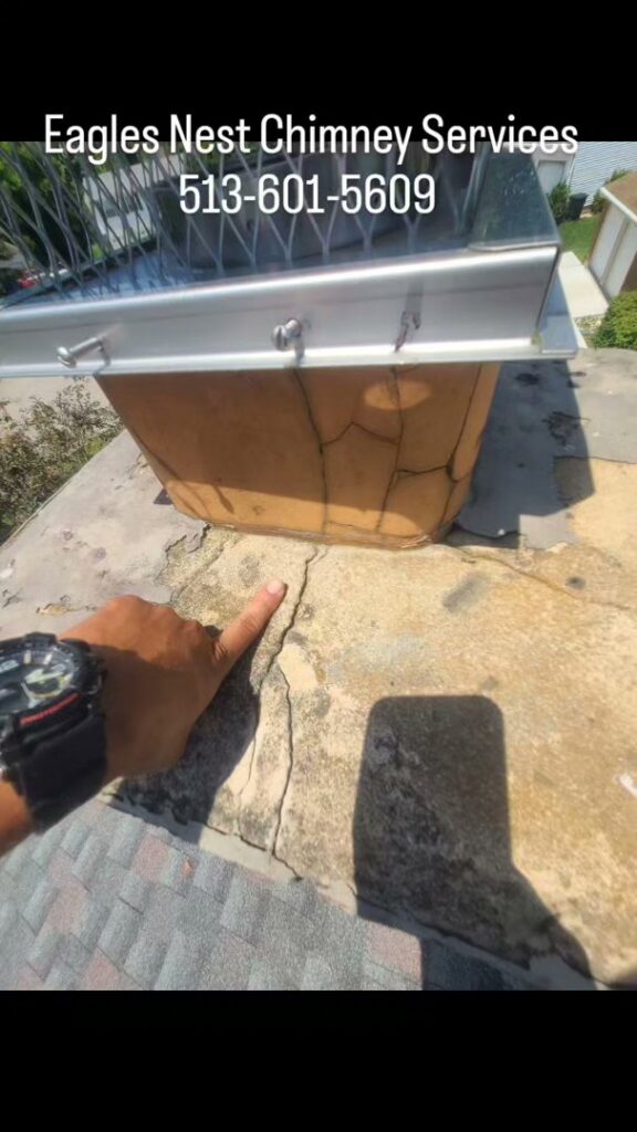 A chimney liner being installed or cleaned from the top of a chimney by Eagles Nest Chimney Services and more of Cincinnati LLC in Cincinnati, OH.