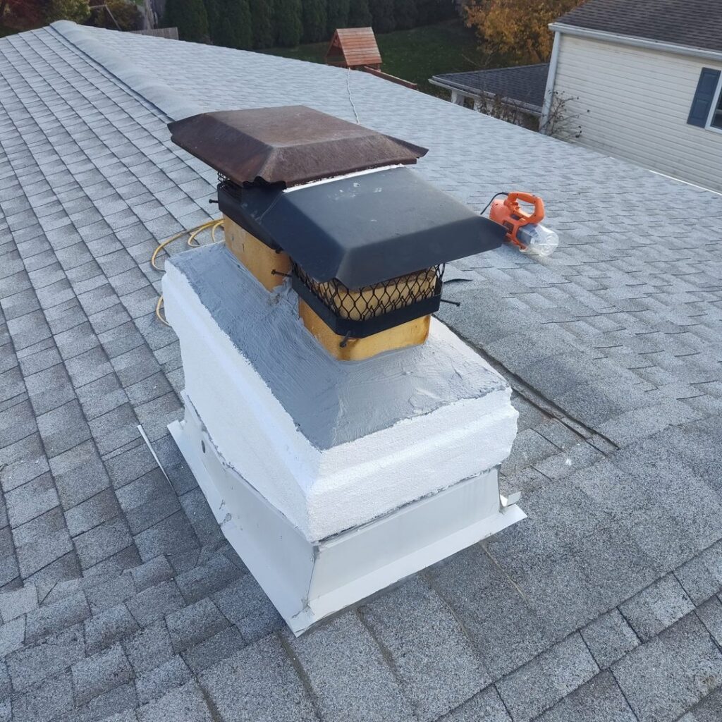 A chimney on a roof undergoing repair or maintenance by Rooftop Chimney Sweeps in Alexandria, VA.